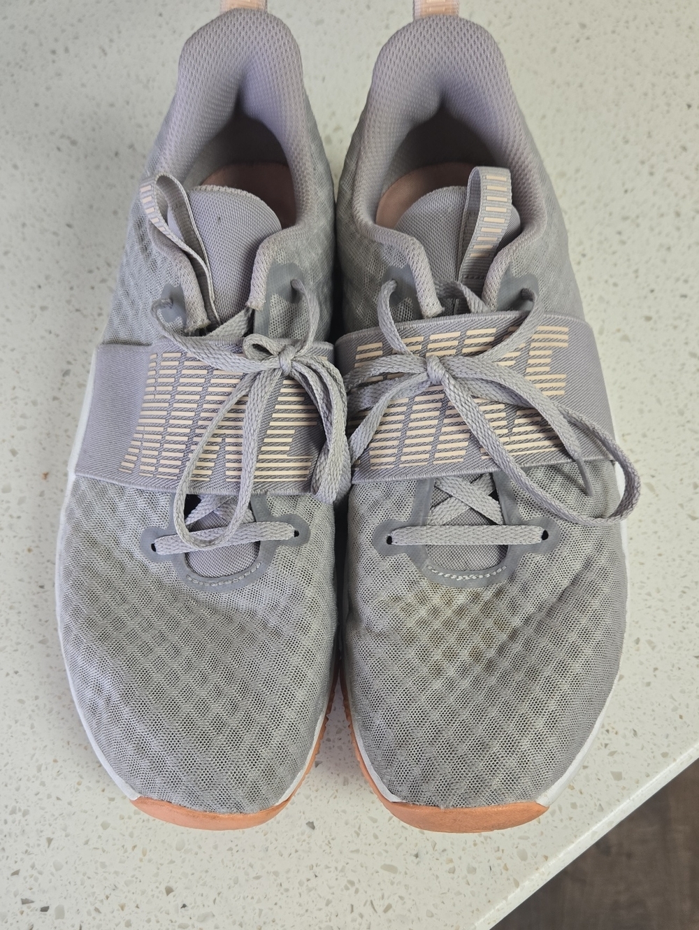 Nike Women’s Light Gray Athletic Sneakers with Peach Accents